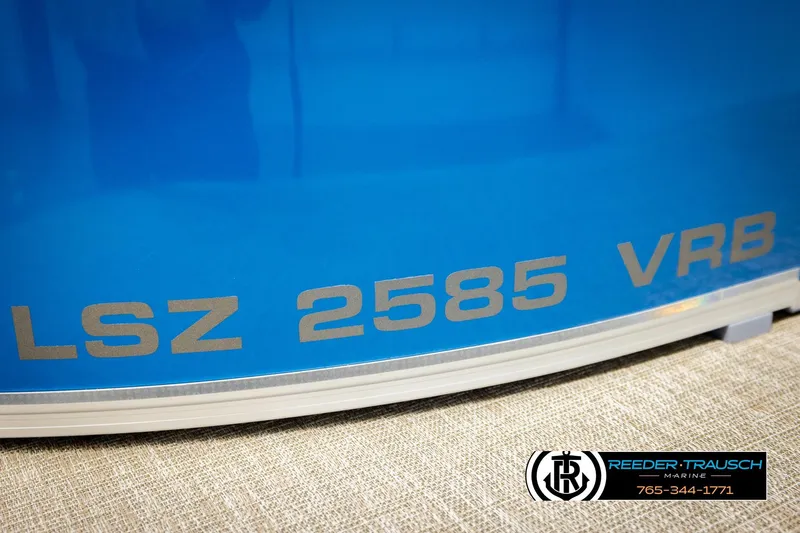 Slide: The Image of Blue Avalon LSZ VRB 2026 boat with Reeder-Trausch Marine logo and contact number. - 52