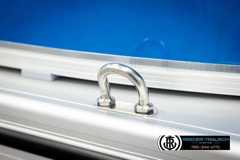 Slide: The Image of Close-up of 2026 Avalon LSZ VRB boat detail with metal fitting and blue background. - 55