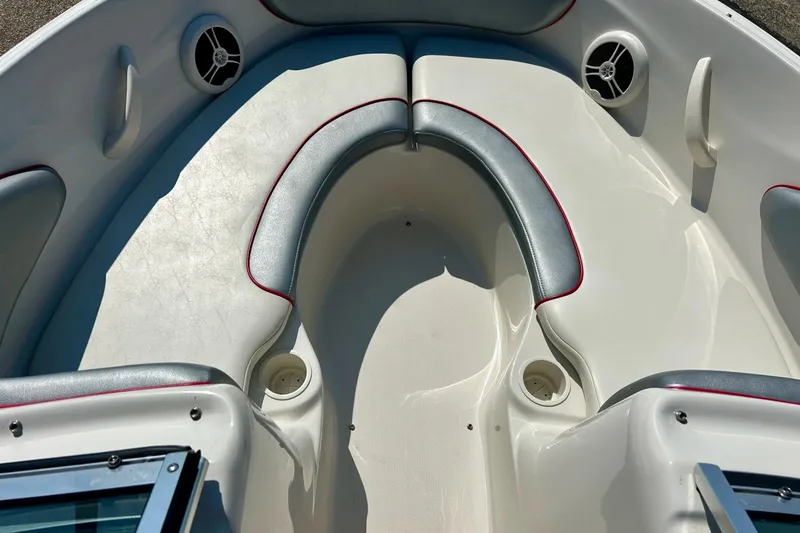 Slide: The Image of 2008 Searay 205 SPORT boat interior with cushioned seating and built-in speakers. - 11