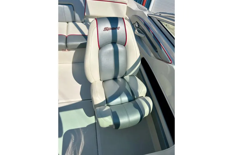 Slide: The Image of 2008 Searay 205 SPORT boat seat with gray and white upholstery, red accents. - 12