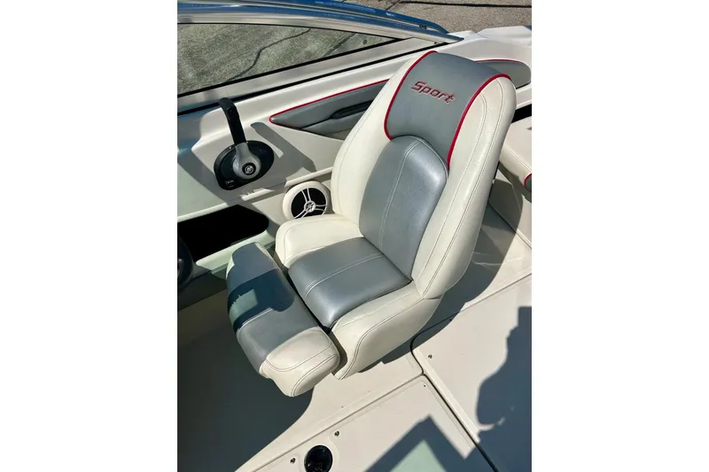 Slide: The Image of 2008 Searay 205 SPORT boat seat with gray and white upholstery, red accents. - 13