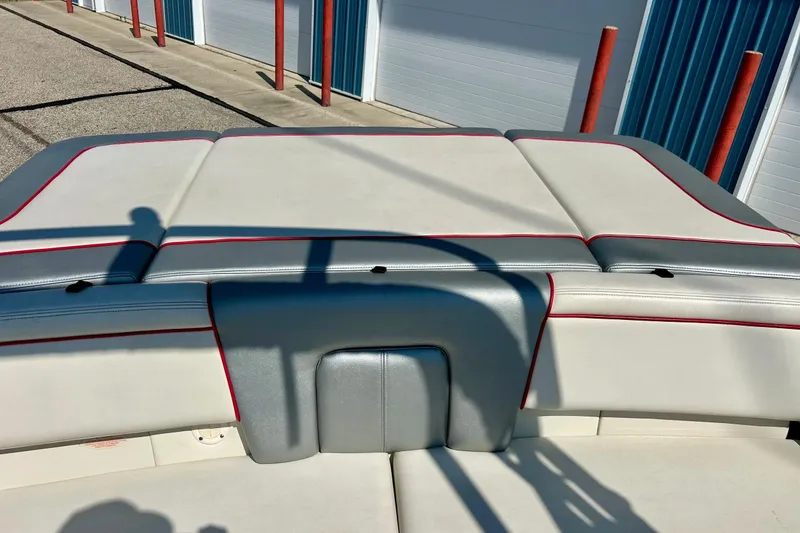 Slide: The Image of 2008 Searay 205 SPORT boat interior with white and gray seating, red accents. - 15