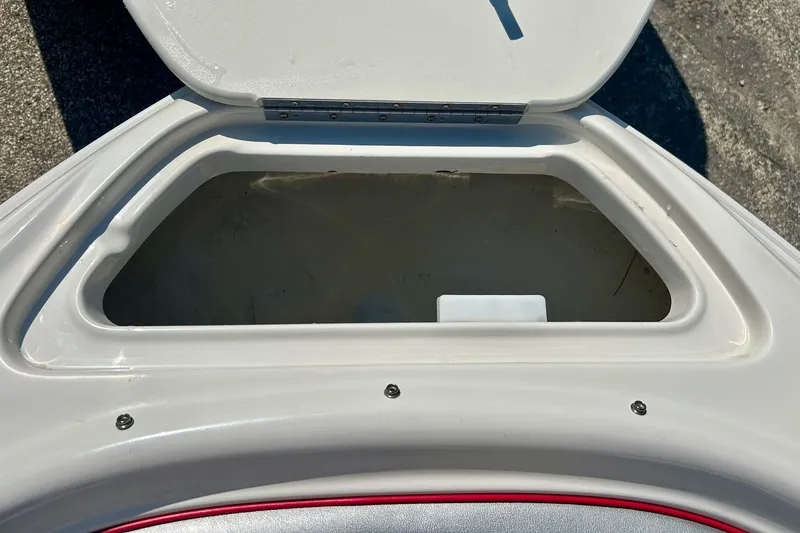 Slide: The Image of Open storage compartment on a 2008 Searay 205 SPORT boat, showcasing interior space. - 16
