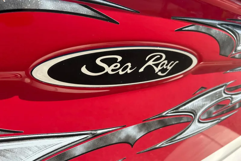 Slide: The Image of Red 2008 Searay 205 SPORT boat with decorative graphics and logo. - 20