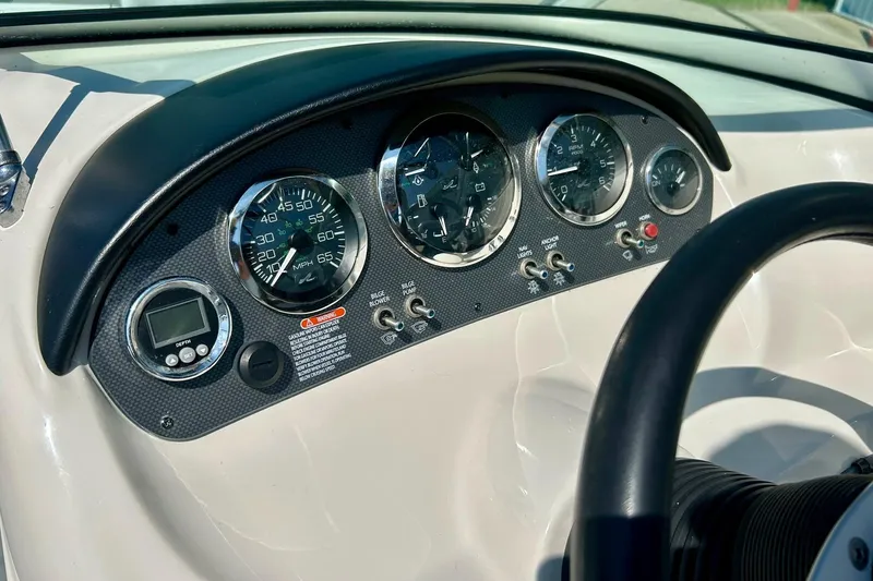 Slide: The Image of Dashboard of 2008 Searay 205 SPORT boat with gauges and controls. - 24