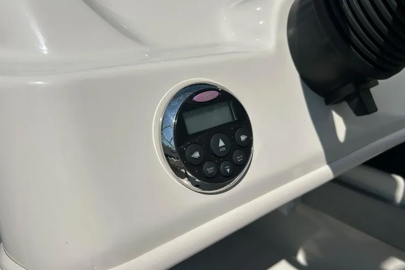 Slide: The Image of Close-up of a 2008 Searay 205 SPORT boat control panel with audio system. - 25