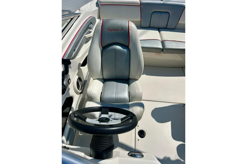 Slide: The Image of 2008 Searay 205 SPORT boat interior with steering wheel and seating. - 29