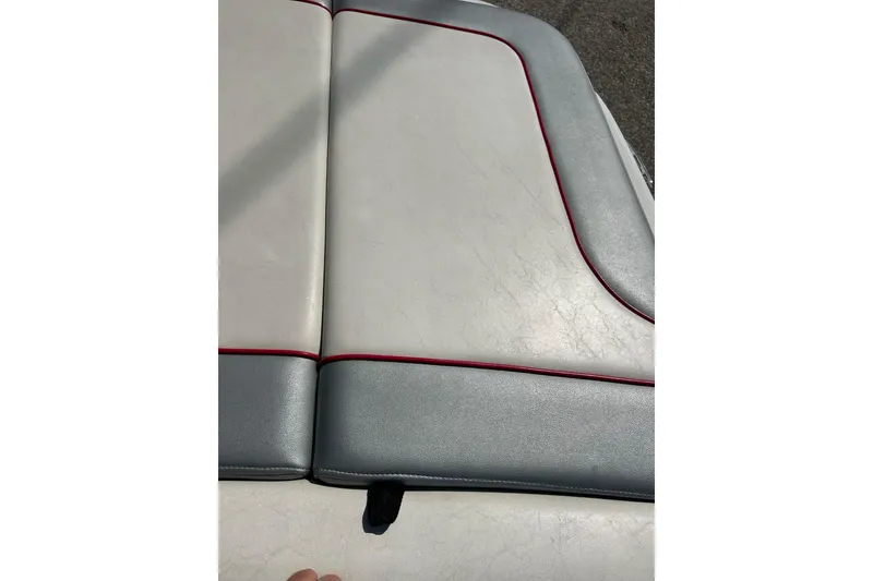 Slide: The Image of 2008 Searay 205 SPORT boat seat with gray and white upholstery, red trim. - 34