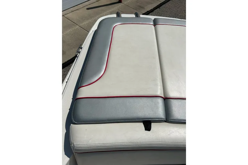 Slide: The Image of 2008 Searay 205 SPORT boat seat with gray and white upholstery, red trim. - 35