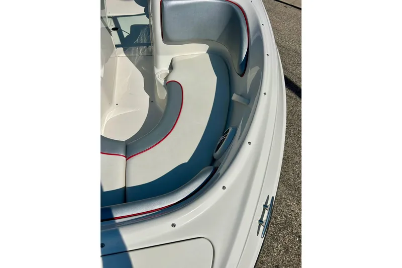 Slide: The Image of 2008 Searay 205 SPORT boat interior with white and gray seating, red trim accents. - 4