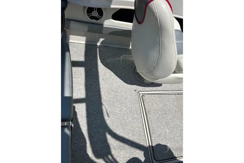Slide: The Image of 2008 Searay 205 SPORT boat interior with gray carpet and white seating. - 42