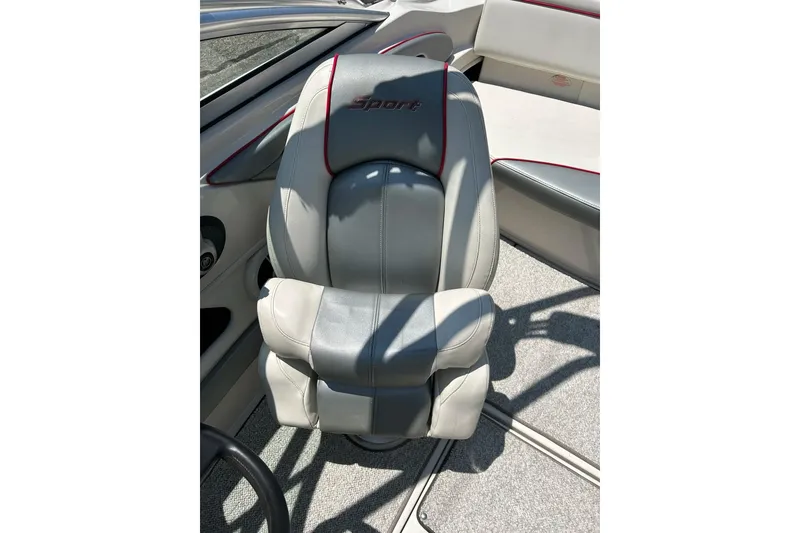 Slide: The Image of 2008 Searay 205 SPORT boat seat with gray upholstery and red accents. - 44