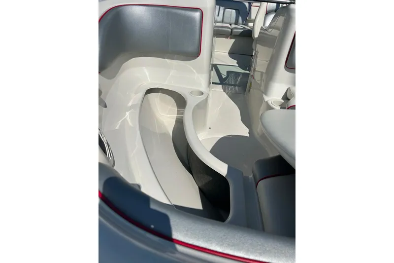 Slide: The Image of 2008 Searay 205 SPORT boat interior with gray seating and red trim accents. - 9
