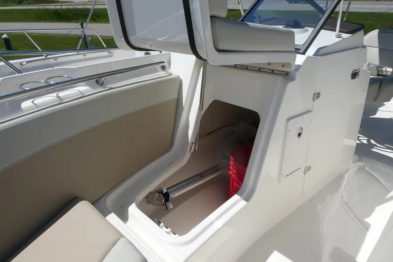 Slide: The Image of 2025 Boston Whaler 210 Vantage boat interior storage compartment. - 12