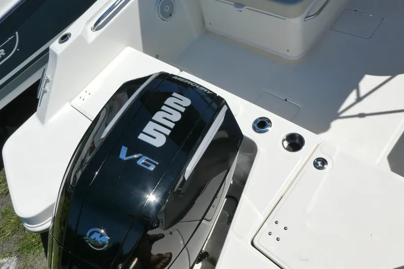 Slide: The Image of 2025 Boston Whaler 210 Vantage with Mercury V6 engine, showcasing sleek design and functionality. - 3