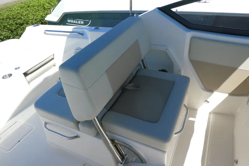 Slide: The Image of 2025 Boston Whaler 210 Vantage boat interior seating with sleek design and comfortable upholstery. - 5