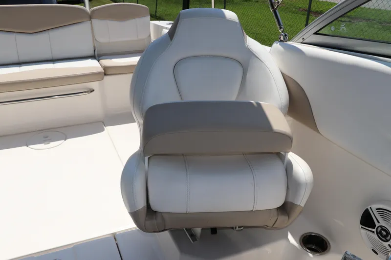 Slide: The Image of 2019 Robalo R207 Dual Console boat interior with cushioned seating and modern design. - 20