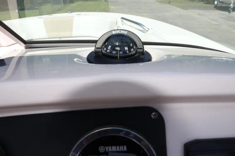 Slide: The Image of 2019 Robalo R207 Dual Console boat dashboard with Ritchie compass and Yamaha gauge. - 28