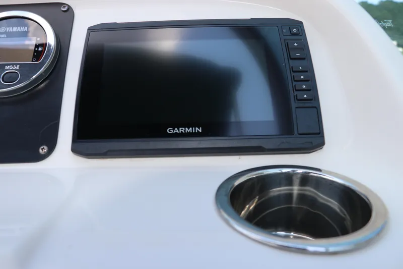 Slide: The Image of 2019 Robalo R207 Dual Console dashboard with Garmin display and Yamaha controls. - 30
