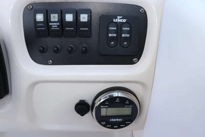 Slide: The Image of Control panel of 2019 Robalo R207 Dual Console with switches and Clarion audio system. - 32