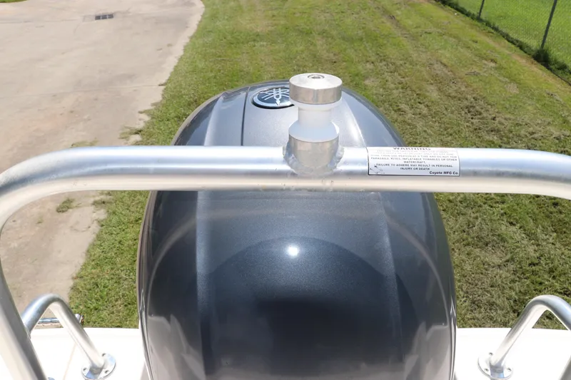 Slide: The Image of 2019 Robalo R207 Dual Console boat engine with safety railing, viewed from above. - 4