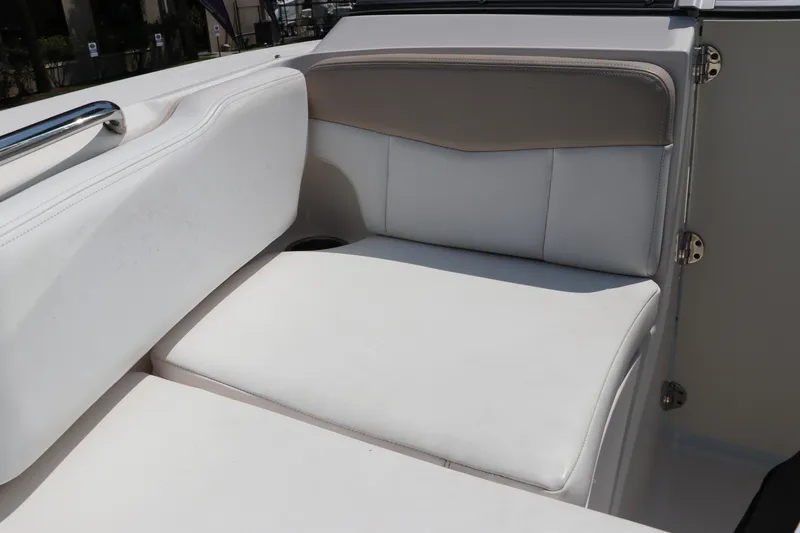Slide: The Image of 2019 Robalo R207 Dual Console boat interior seating with white upholstery. - 41