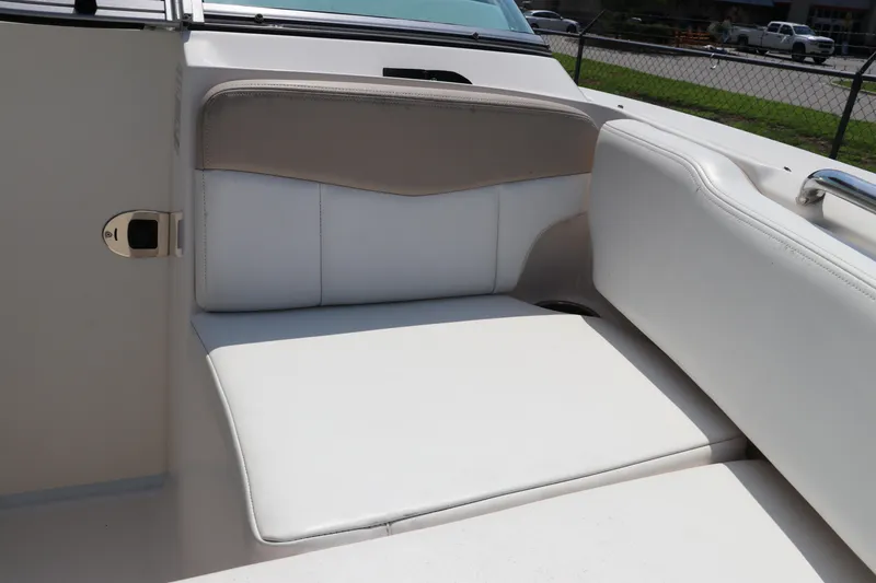 Slide: The Image of 2019 Robalo R207 Dual Console boat interior seating, white and beige upholstery. - 42