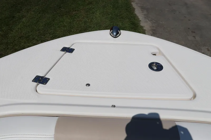 Slide: The Image of 2019 Robalo R207 Dual Console boat deck with storage hatch and hardware. - 49