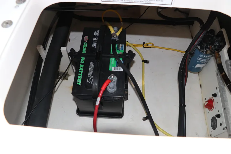 Slide: The Image of Battery compartment of 2019 Robalo R207 Dual Console boat with wiring and components. - 8