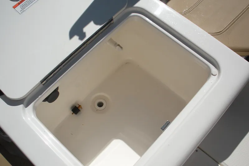 Slide: The Image of 2025 Bayliner Trophy T20CC boat storage compartment, open and empty. - 18