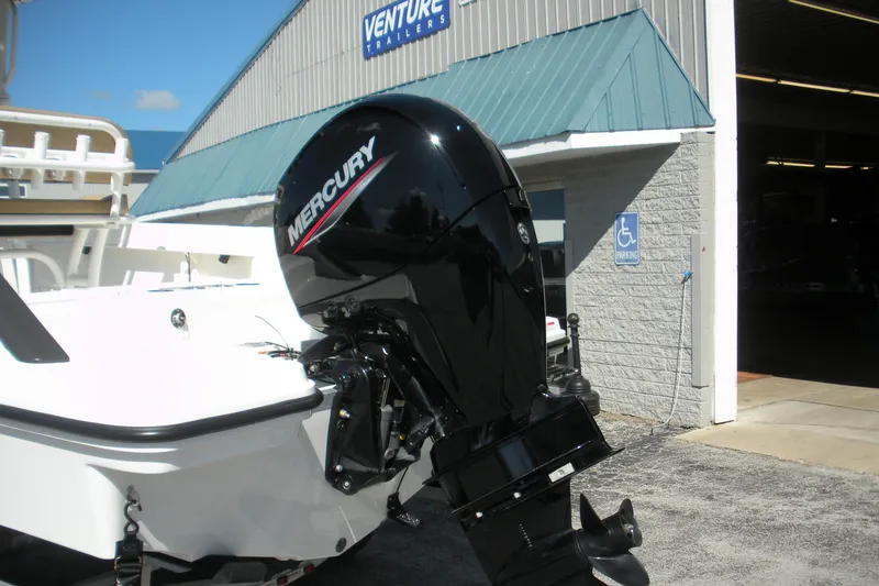 Slide: The Image of 2025 Bayliner Trophy T20CC with Mercury outboard motor at dealership. - 20