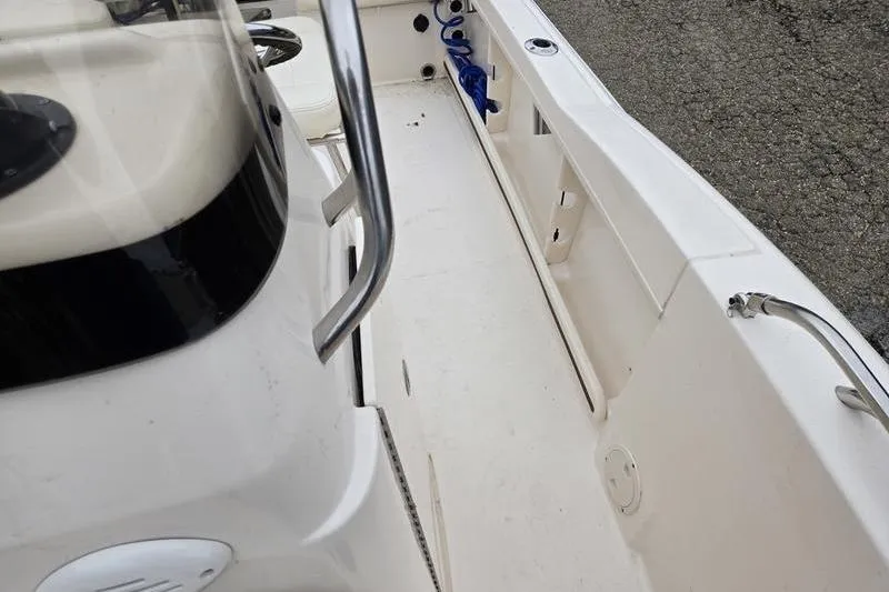 Slide: The Image of 2024 Grady-White Fisherman 180 boat interior with clean deck and stainless steel railing. - 12