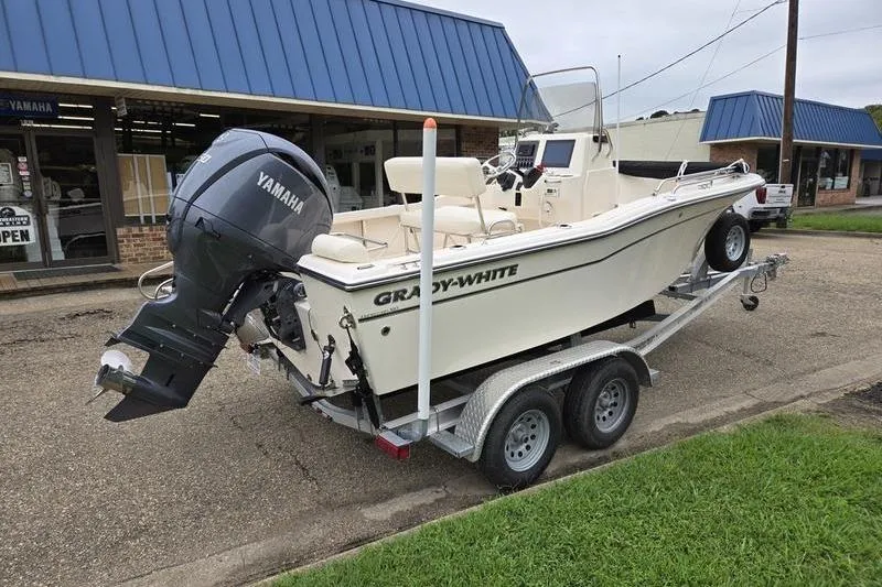 Slide: The Image of 2024 Grady-White Fisherman 180 boat on trailer with Yamaha outboard motor. - 3
