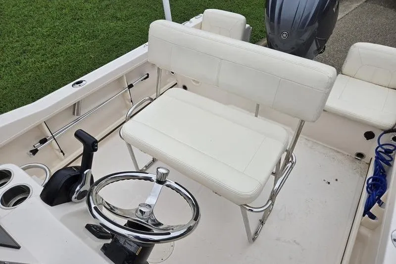 Slide: The Image of 2024 Grady-White Fisherman 180 boat interior with steering wheel and seating. - 6