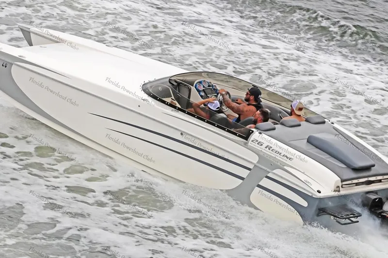 The Image of 2008 RPM REDLINE powerboat cruising with passengers on a wavy sea. - 1