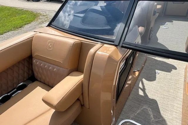 Slide: The Image of Luxurious tan interior of 2025 Godfrey San Pan SP2700SBW boat with quilted seating. - 22