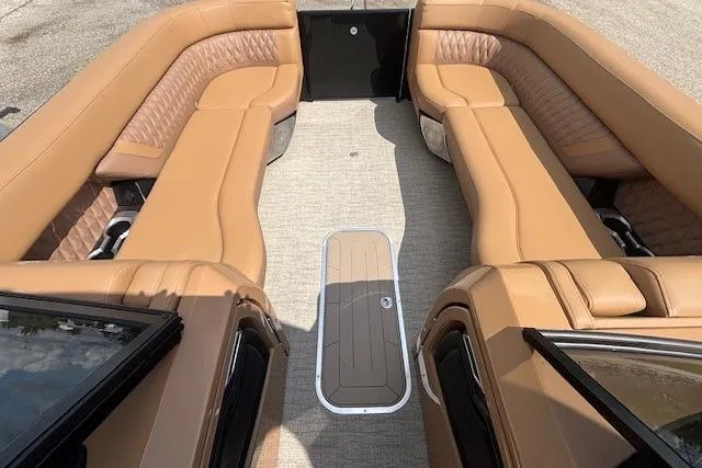 Slide: The Image of Luxurious interior of 2025 Godfrey San Pan SP2700SBW pontoon boat with tan leather seating. - 26