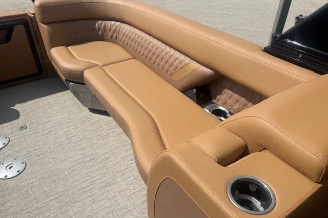 Slide: The Image of Luxurious tan seating on 2025 Godfrey San Pan SP2700SBW boat with cup holders. - 29