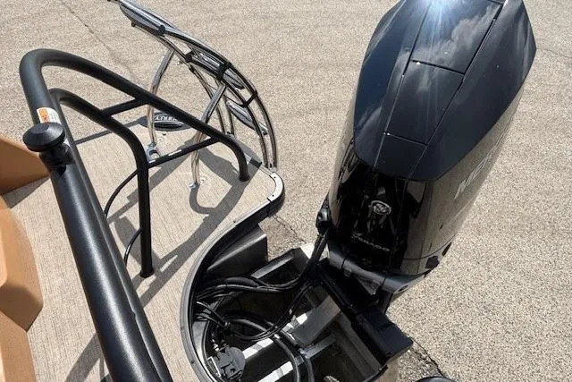 Slide: The Image of 2025 Godfrey San Pan SP2700SBW boat with powerful outboard motor on a sunny day. - 42