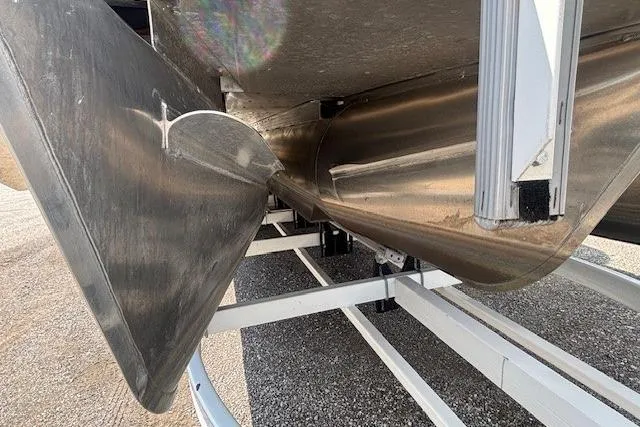 Slide: The Image of Underneath view of a 2025 Godfrey San Pan SP2700SBW pontoon boat on a trailer. - 47