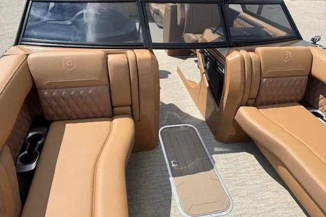 Slide: The Image of Luxurious interior of 2025 Godfrey SAN PAN SP 2700 SBW pontoon boat with tan leather seating. - 53