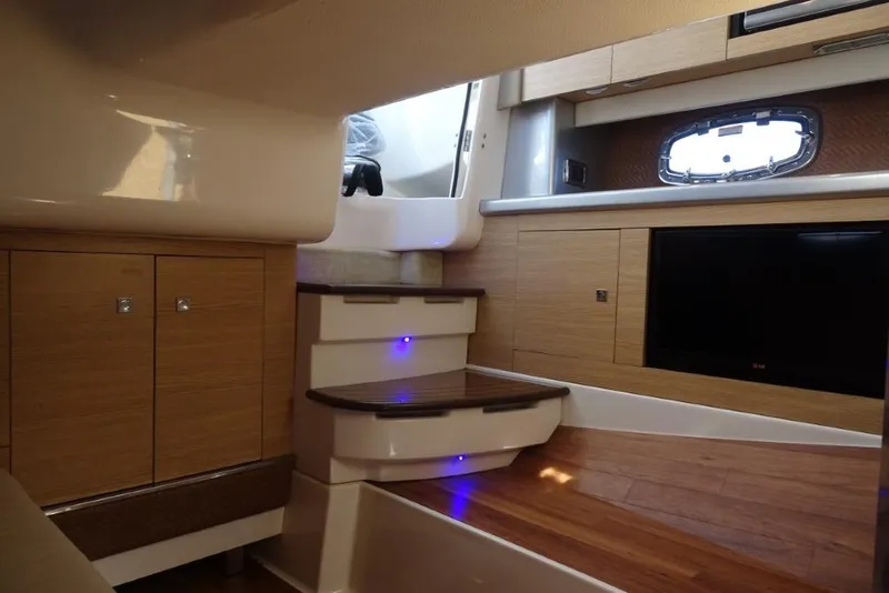 Slide: The Image of Interior of 2015 Chaparral 327 SSX boat with wood cabinetry and modern design. - 23