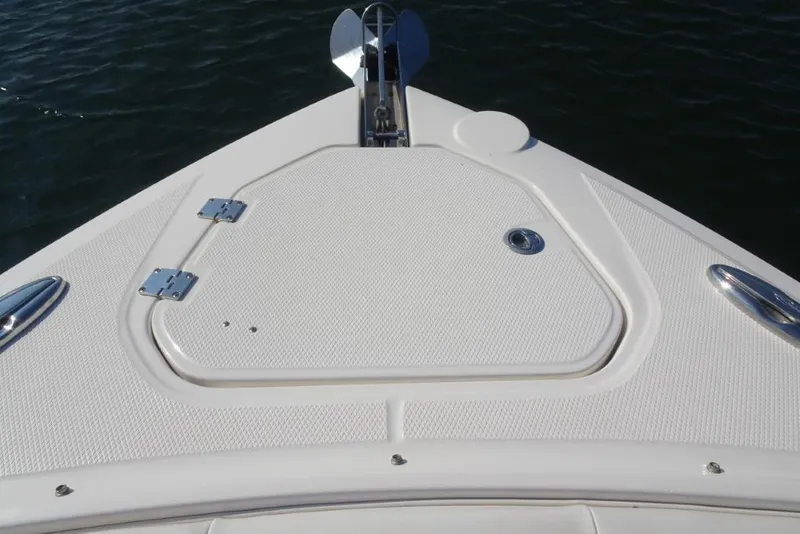 Slide: The Image of Bow of 2015 Chaparral 327 SSX boat with anchor hatch and stainless steel fittings. - 28