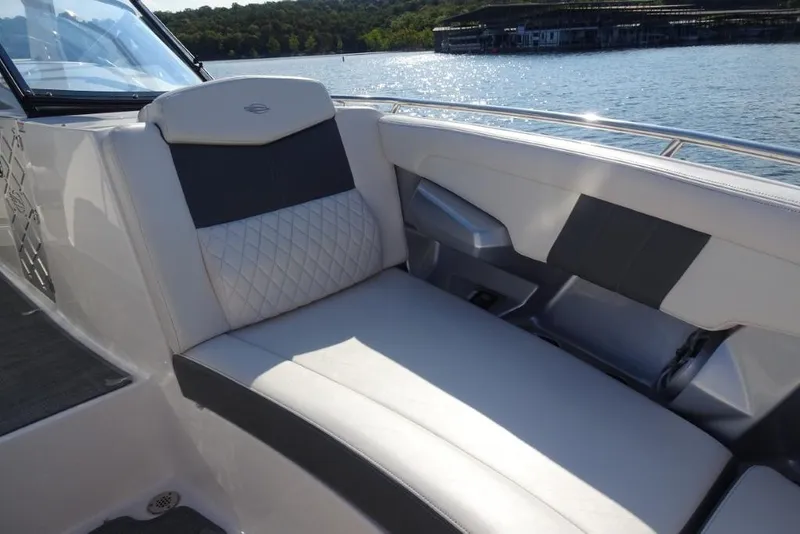 Slide: The Image of 2015 Chaparral 327 SSX boat interior with luxurious seating by the water. - 30