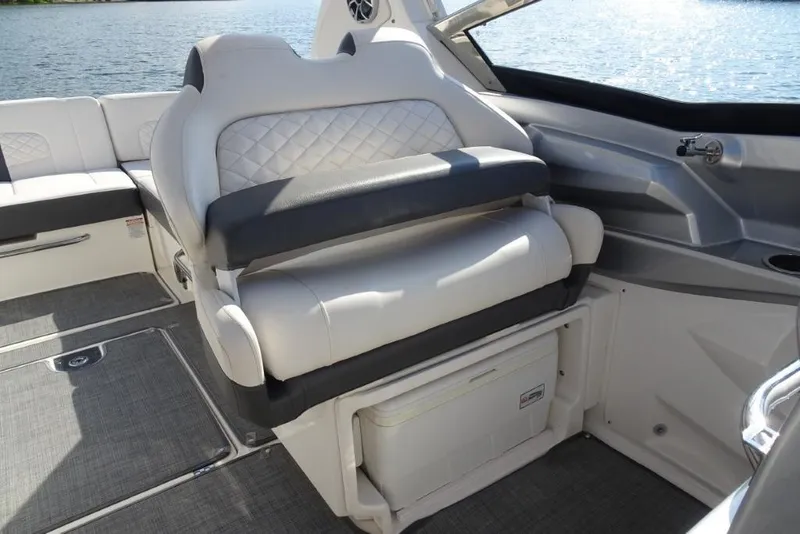 Slide: The Image of 2015 Chaparral 327 SSX boat interior with luxurious seating and lake view. - 33