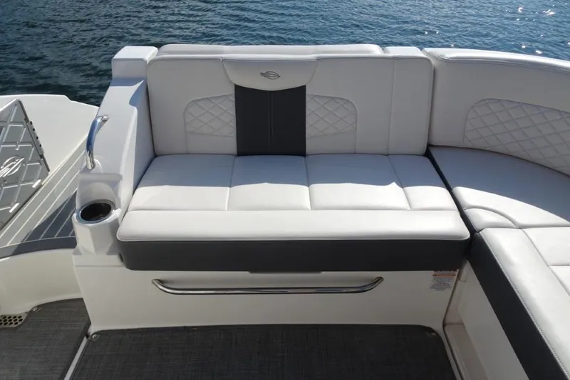 Slide: The Image of Luxury seating on 2015 Chaparral 327 SSX boat, featuring elegant white upholstery. - 35