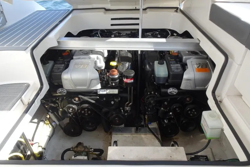 Slide: The Image of Engine compartment of 2015 Chaparral 327 SSX boat, featuring dual V8 engines. - 37