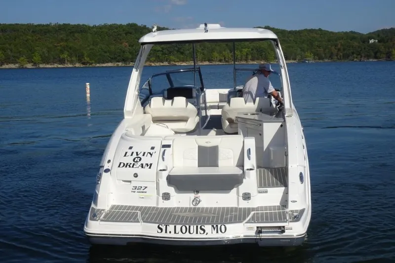 Slide: The Image of 2015 Chaparral 327 SSX boat on lake, rear view, "Livin' the Dream" text, St. Louis, MO. - 7