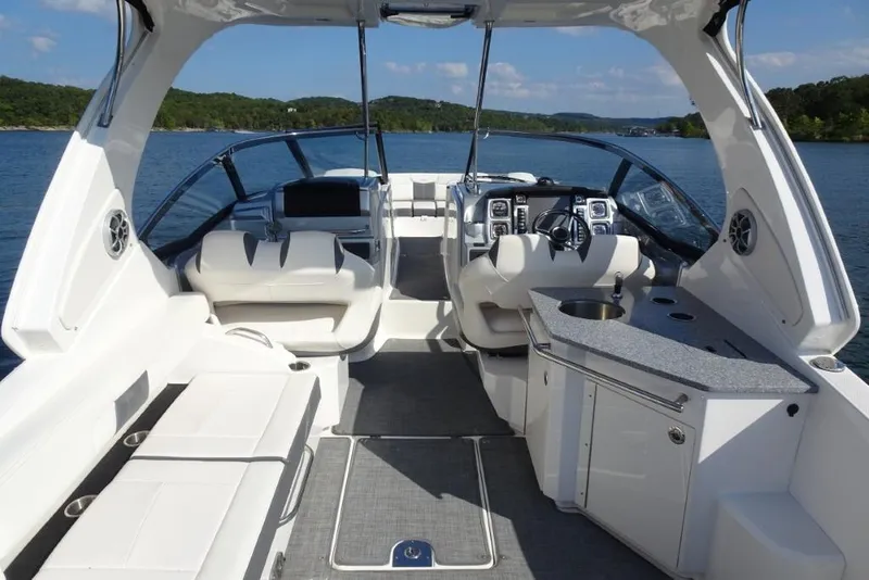 Slide: The Image of 2015 Chaparral 327 SSX boat interior with luxurious seating and modern dashboard. - 8