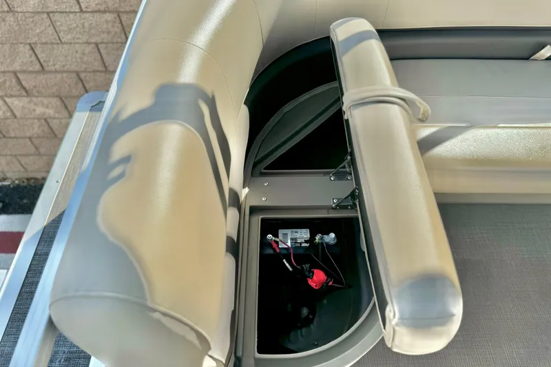 Slide: The Image of 2021 Sun Tracker Party Barge 18 DLX seating with storage compartment open. - 13